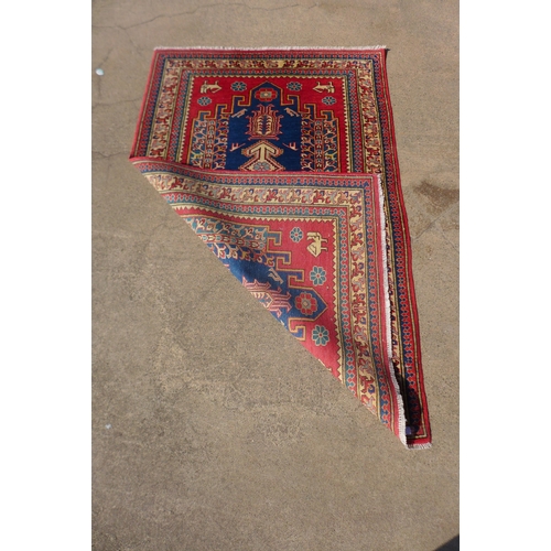 237 - An Afghan Shirawan terracotta ground rug