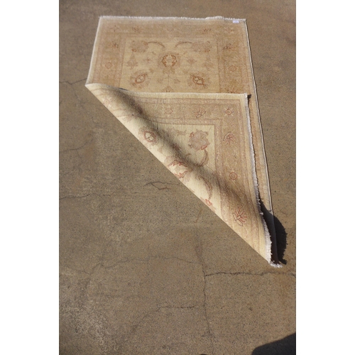 238 - An Afghan Ziegler cream ground rug