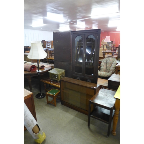 241 - An oak freestanding corner cabinet, a standard lamp, small bookcase, etc. (4)