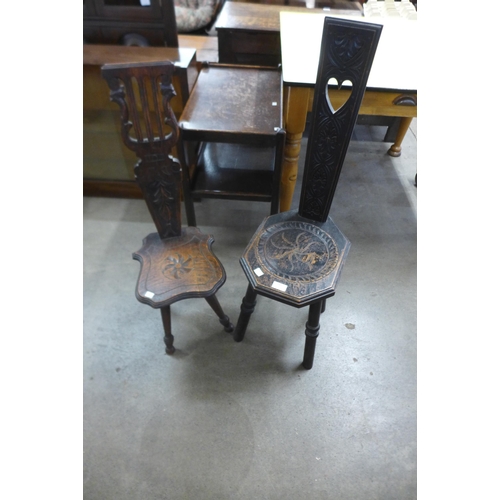 243 - Two Arts and Crafts carved oak spinning stools