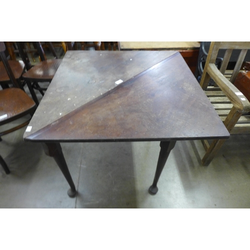 249 - A George III mahogany fold-over corner tea table