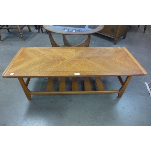 31 - A teak coffee table