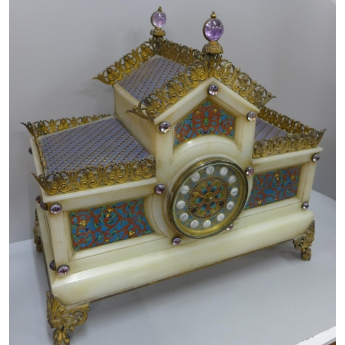 312 - A 19th Century French 8-day exhibition quality white onyx and gilt metal table clock, in the form of... 