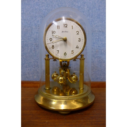 318 - An early 20th Century inlaid mahogany timepiece and an anniversary clock