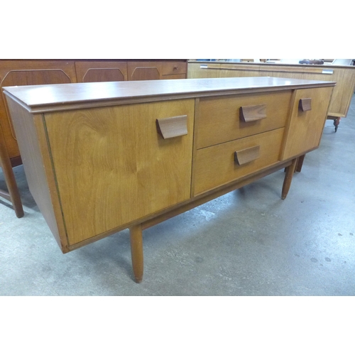 32 - A teak sideboard