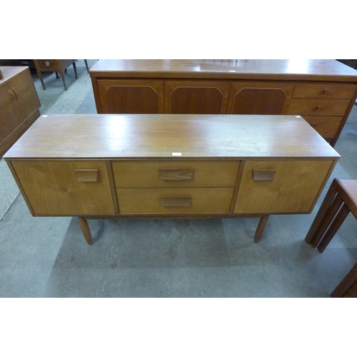 32 - A teak sideboard