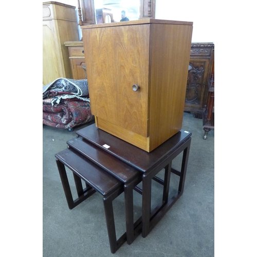 43 - A teak bedside cabinet and a mahogany nest of tables