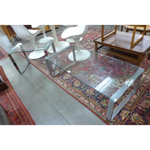 52a - A chrome and glass coffee table with matching occasional table