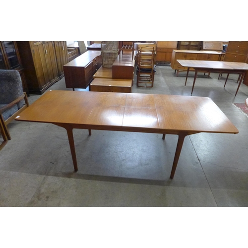 7 - A McIntosh teak T3 extending dining table