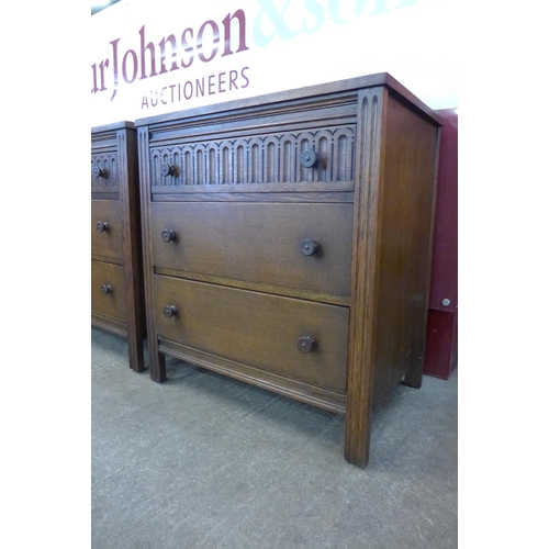 74 - A pair of carved oak chests of drawers