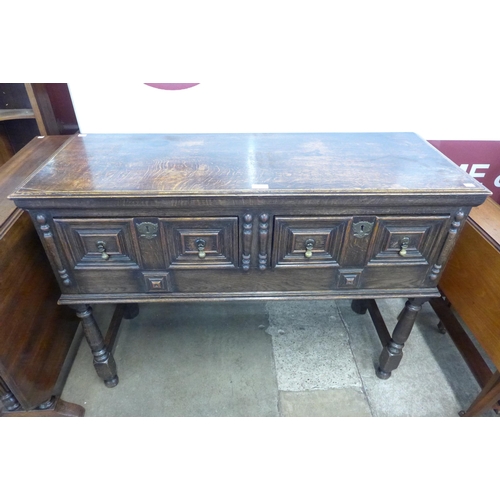 75 - A Jacobean Revival carved oak dresser