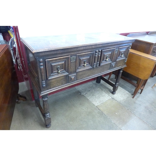 75 - A Jacobean Revival carved oak dresser