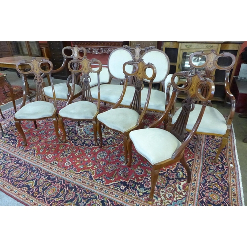 81 - An Art Nouveau inlaid mahogany seven piece salon suite