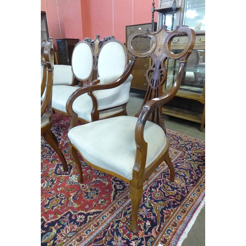 81 - An Art Nouveau inlaid mahogany seven piece salon suite