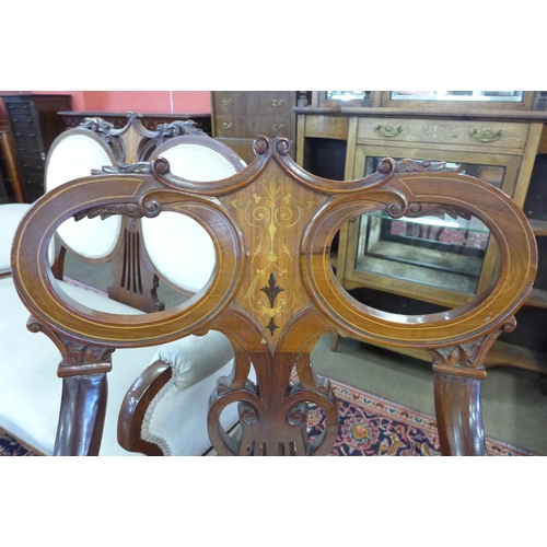 81 - An Art Nouveau inlaid mahogany seven piece salon suite