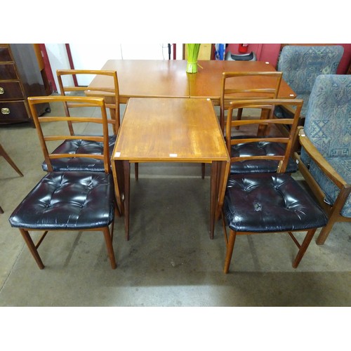 64 - A teak drop-leaf table and four chairs