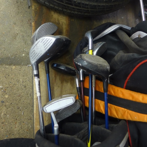 2155 - 4 golf bags with clubs