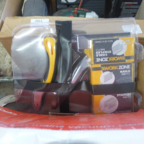 2011 - Box of misc. items inc. battery charger, sharpening station, light, cordless drill, etc.