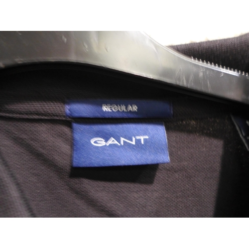 3272 - 2 Men's Gant polo T-shirts, (medium black and large navy) * this lot is subject to VAT