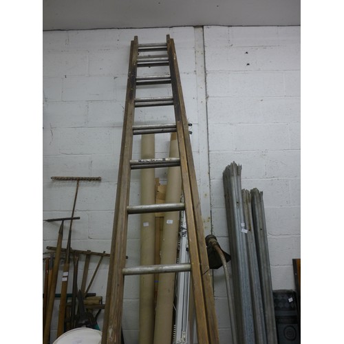 2070a - Approx. 12m of white plastic pipe and 2 wooden ladders