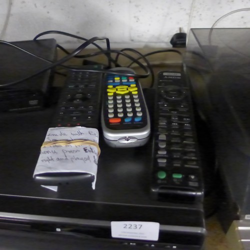 2237 - Sony DVD player, Bush DVD player, and a Sony DVD player with various remotes