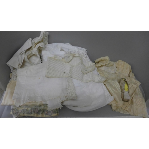 1004 - A collection of linen and clothing, circa 1900