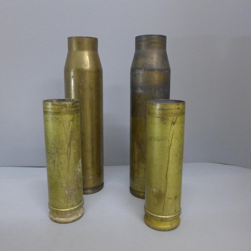 619 - A pair of WWI flying gloves and four brass  shell casings