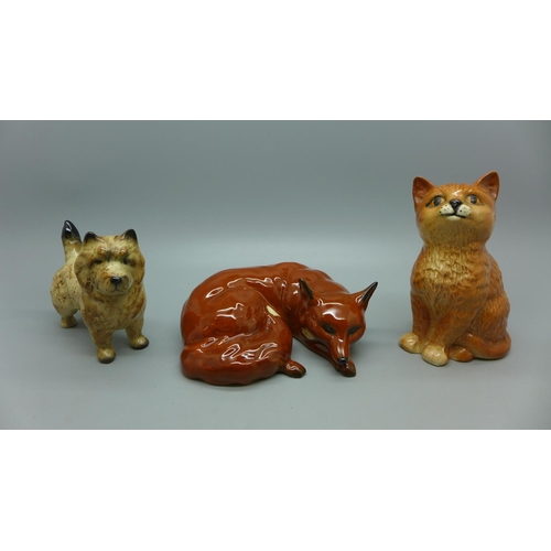 634 - Three Beswick models; laying fox, cat and Norfolk Terrier