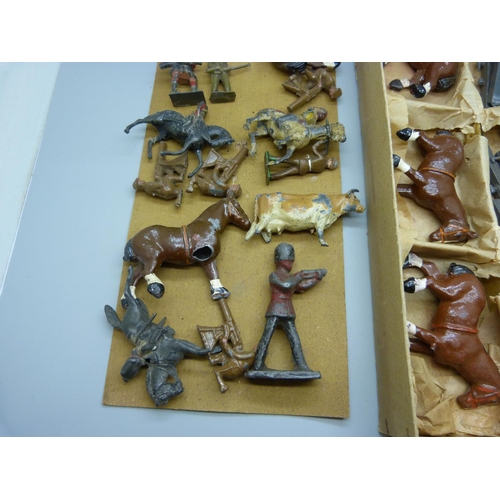 646 - A box of early 20th Century lead soldiers, warships, horses, etc., some a/f