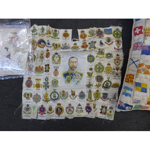 755 - A collection of military cigarette card silks made into a cushion, a similar cushion front and a col... 