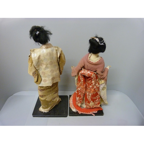 799 - Two Japanese figures dressed in traditional dress, a/f, 43cm