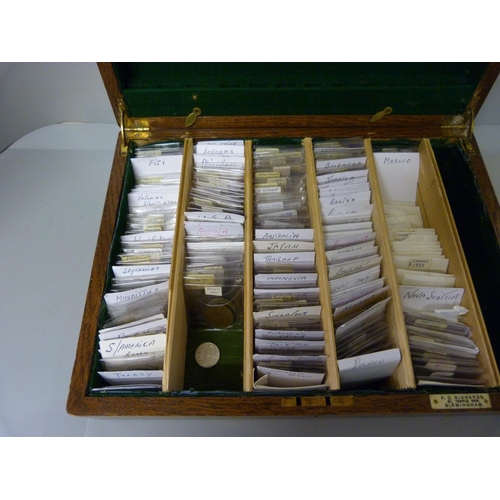 802 - A case of mixed world coins, approximately 200+ coins, sorted into separate countries