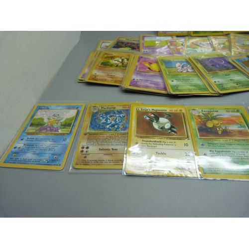 831 - Approximately 100 Pokemon cards, 28 Base set including shiny Machamp, Jungle and Dark Set with first... 