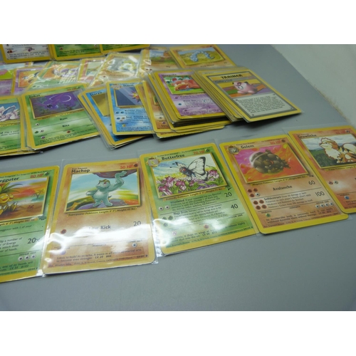 831 - Approximately 100 Pokemon cards, 28 Base set including shiny Machamp, Jungle and Dark Set with first... 