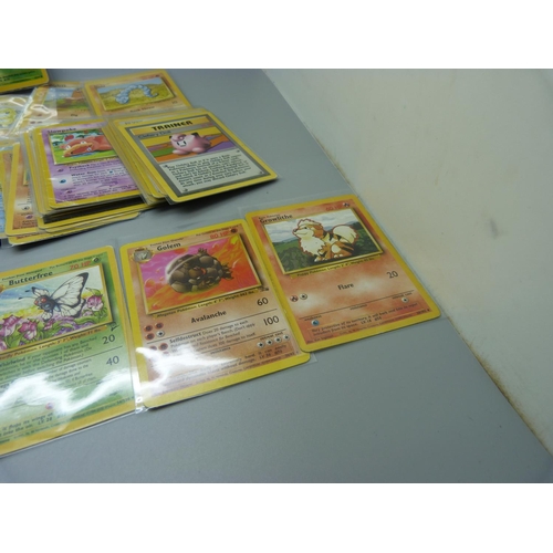 831 - Approximately 100 Pokemon cards, 28 Base set including shiny Machamp, Jungle and Dark Set with first... 