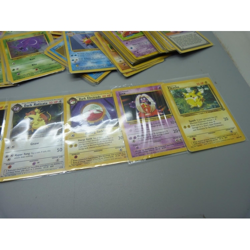 831 - Approximately 100 Pokemon cards, 28 Base set including shiny Machamp, Jungle and Dark Set with first... 