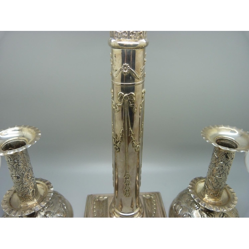 838 - A pair of hallmarked silver candlesticks, London 1901, 14.5cm, and a single plated candlestick