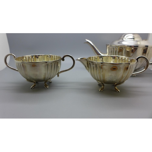 840A - A white metal three piece tea service, foreign hallmarks, 668g