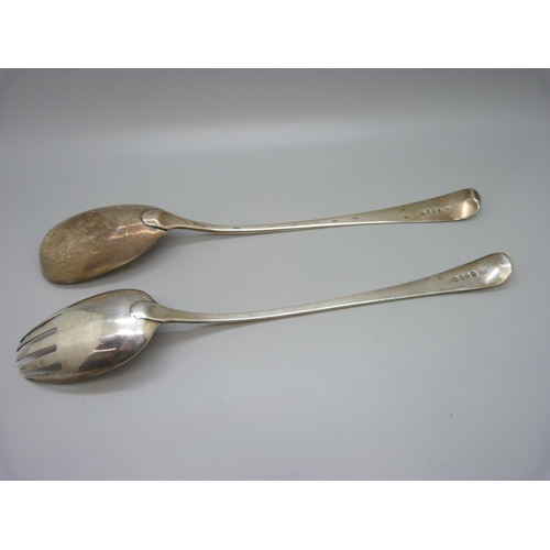 847 - A matched pair of silver salad servers, crested, London 1798 and 1810, 197g