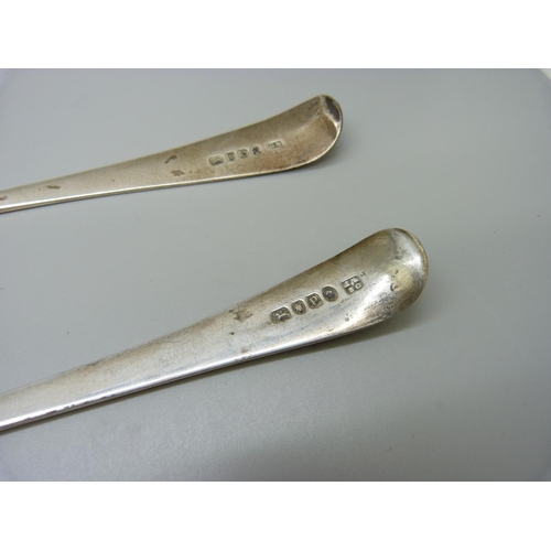 847 - A matched pair of silver salad servers, crested, London 1798 and 1810, 197g