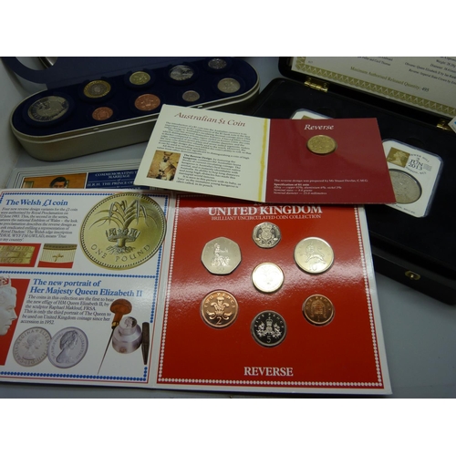 893 - A collection of coins including a Millennium set and a Coronation Anniversary crown set