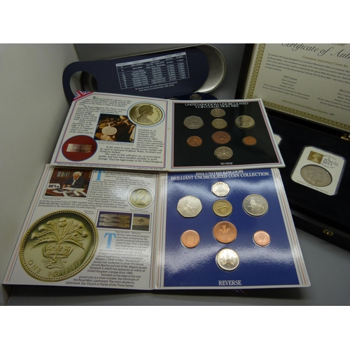 893 - A collection of coins including a Millennium set and a Coronation Anniversary crown set