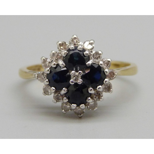 922 - An 18ct gold, sapphire and diamond cluster ring, 4g, Q