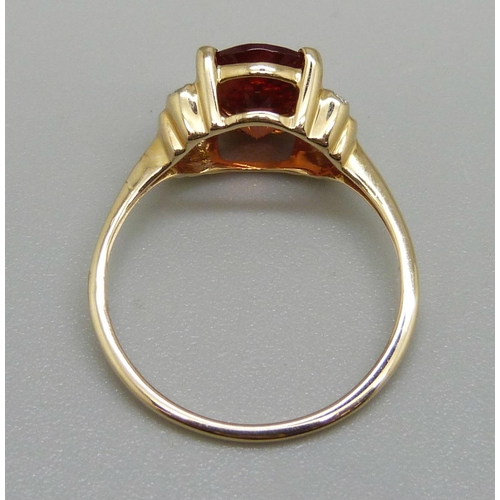 930 - A 9ct gold, Oregon sunstone and diamond ring, 2.1g, O