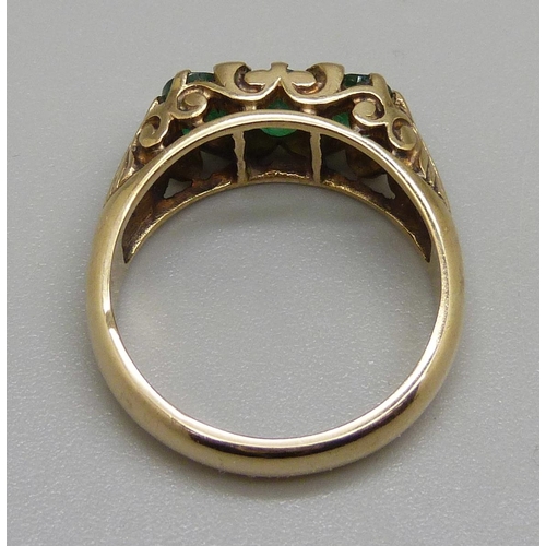 934 - A 9ct gold, emerald and diamond ring, 5.2g, O, centre stone a/f