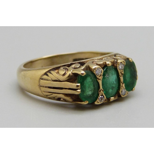 934 - A 9ct gold, emerald and diamond ring, 5.2g, O, centre stone a/f