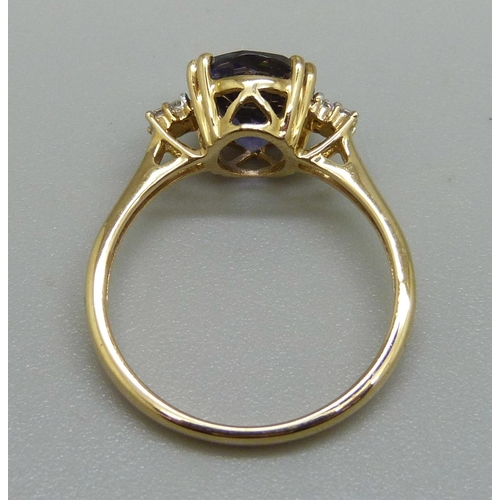 935 - A 9ct gold, iolite and diamond ring, 2.4g, N