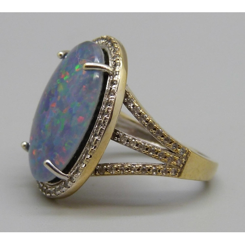 936 - A silver gilt mosaic opal and white stone ring, P, stone approximately 14mm x 19mm