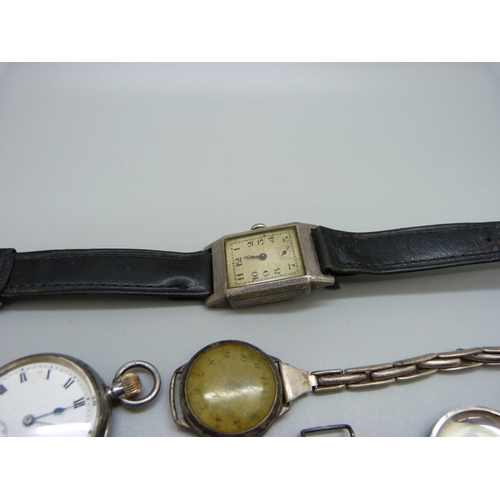 940 - A silver cased wristwatch lacking minute hand, 24mm case, two other silver wristwatches and an Omega... 