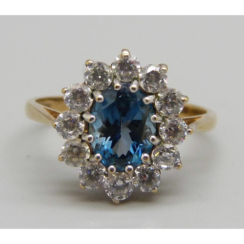 942 - A 9ct gold, topaz and white stone cluster ring, 2.8g, O